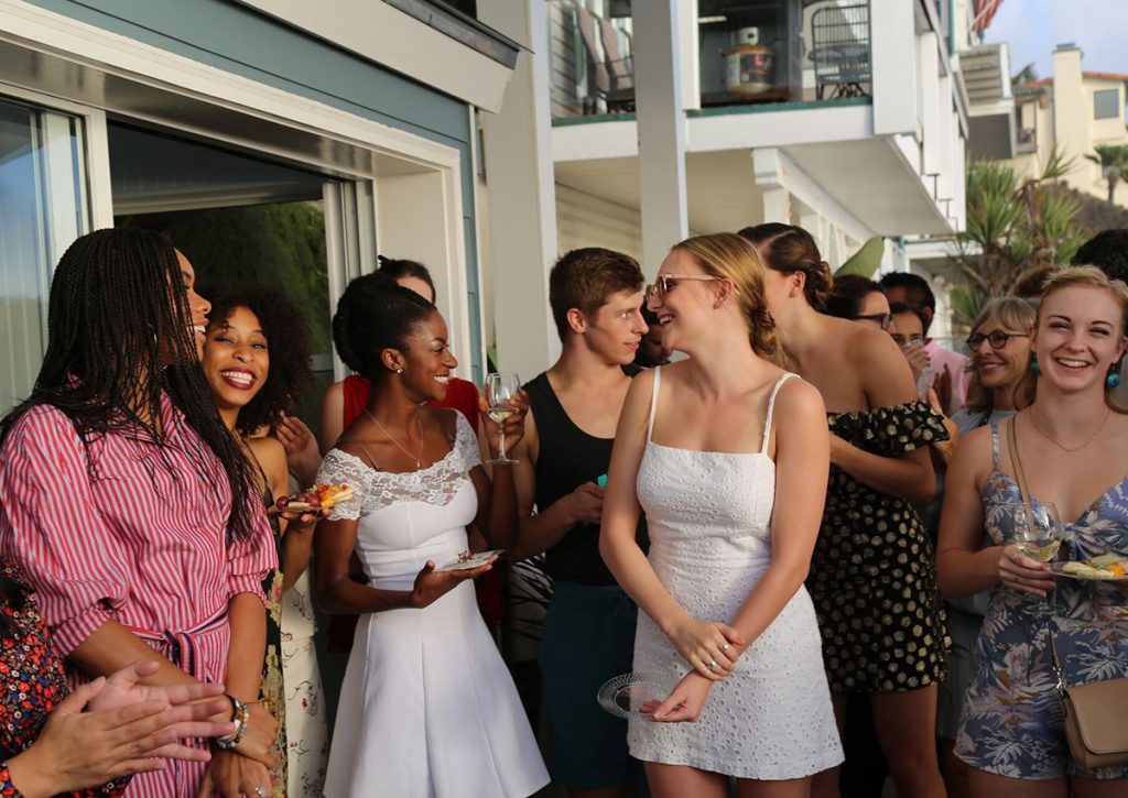 people smiling at sunny outdoor reception