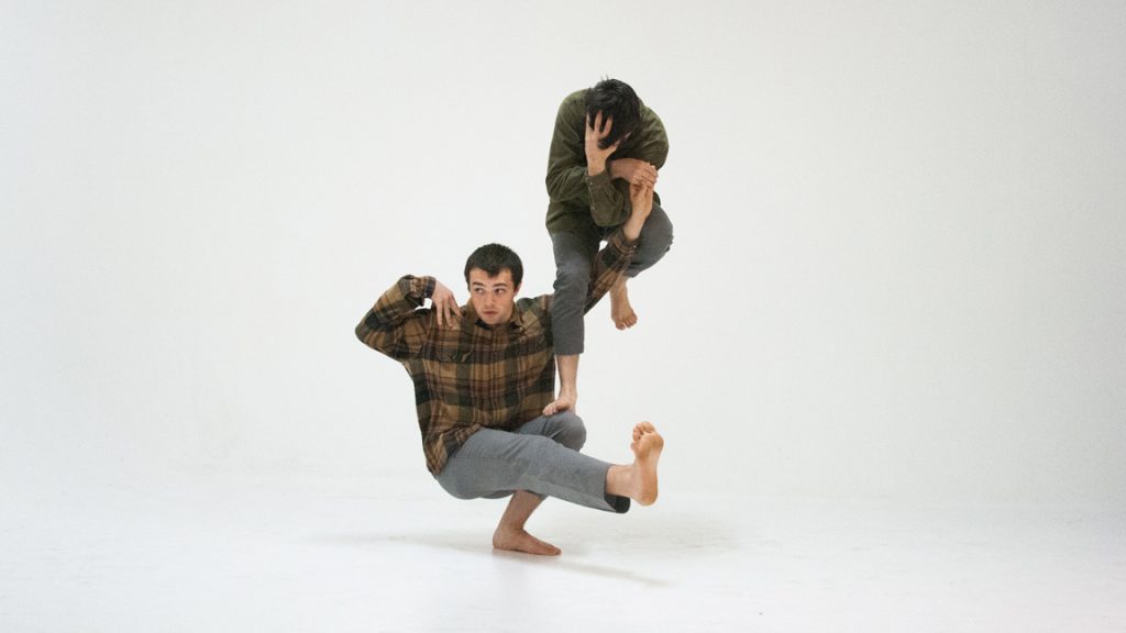 JA Collective dancers in intricate balancing pose