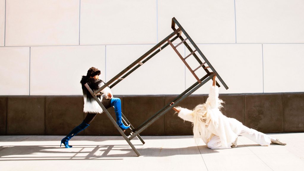 Dancers dancing on jail bed