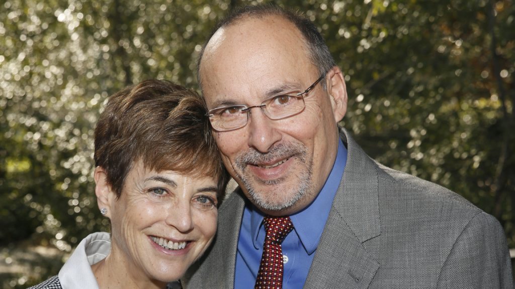 Woman and man posing and smiling together