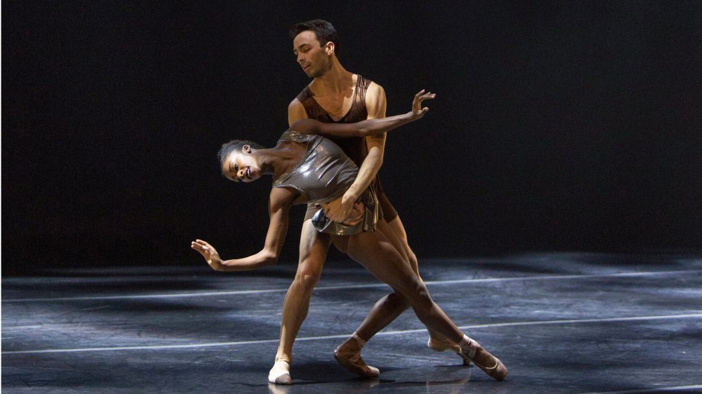 ballerina and male ballet dancer partnering onstage