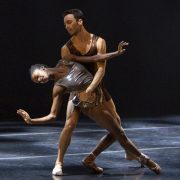 ballerina and male ballet dancer partnering onstage
