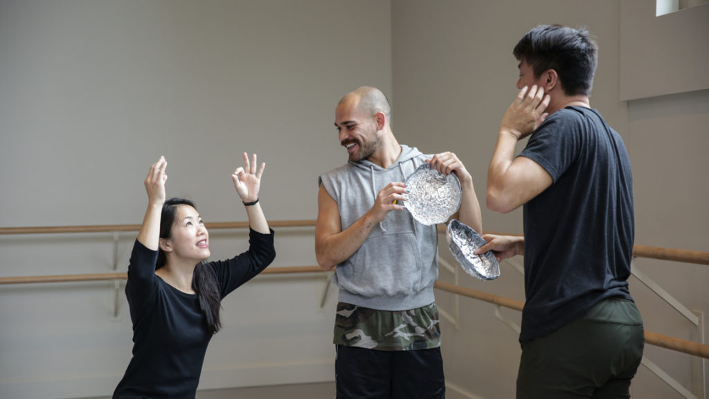 woman showing movement to dancers