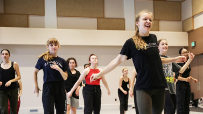 Woman leading dance class at Taylor intensive