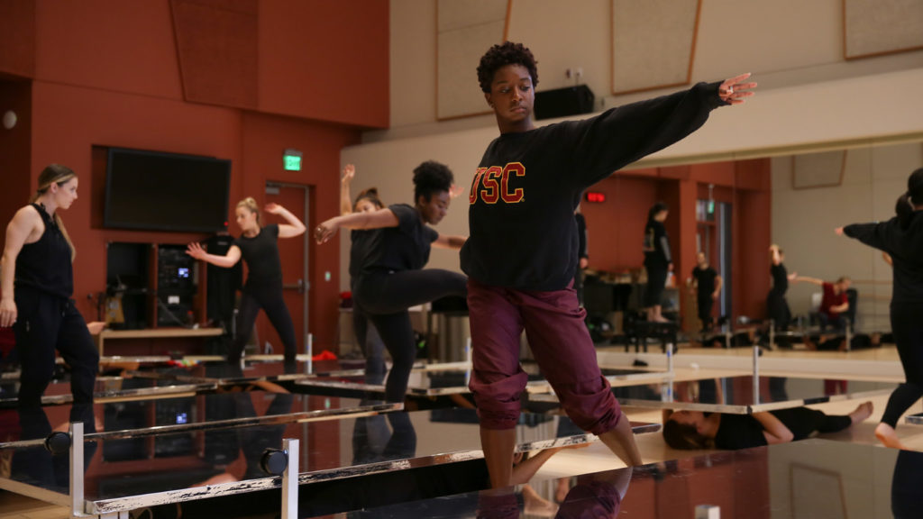 Dancer standing over mirrors