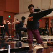 Dancer standing over mirrors