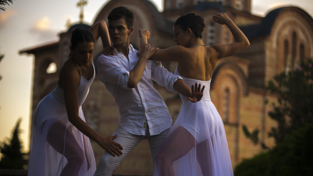 Alyssa, Brenden, and Sophia pose in white