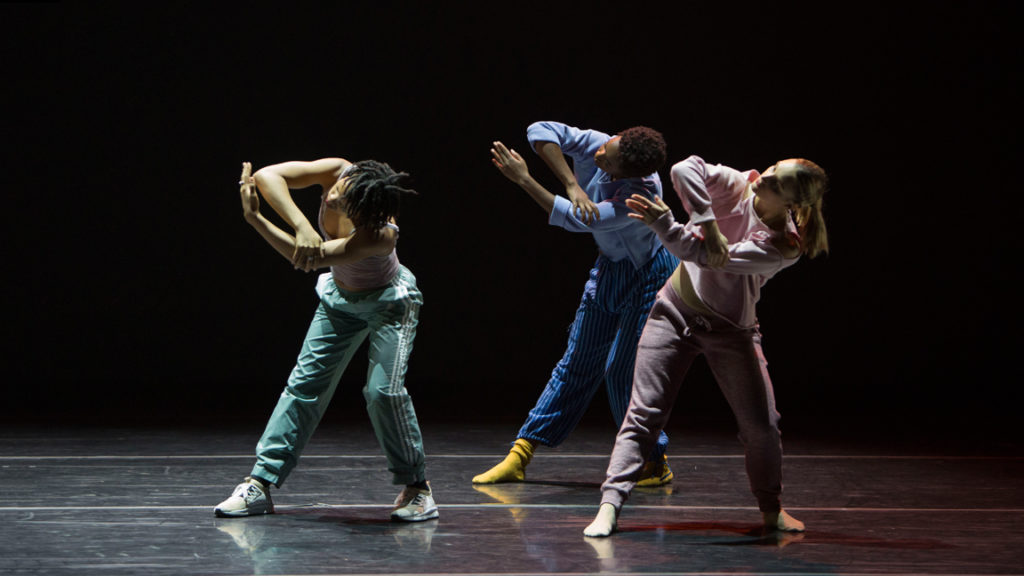 dancers in pastel colors matching position