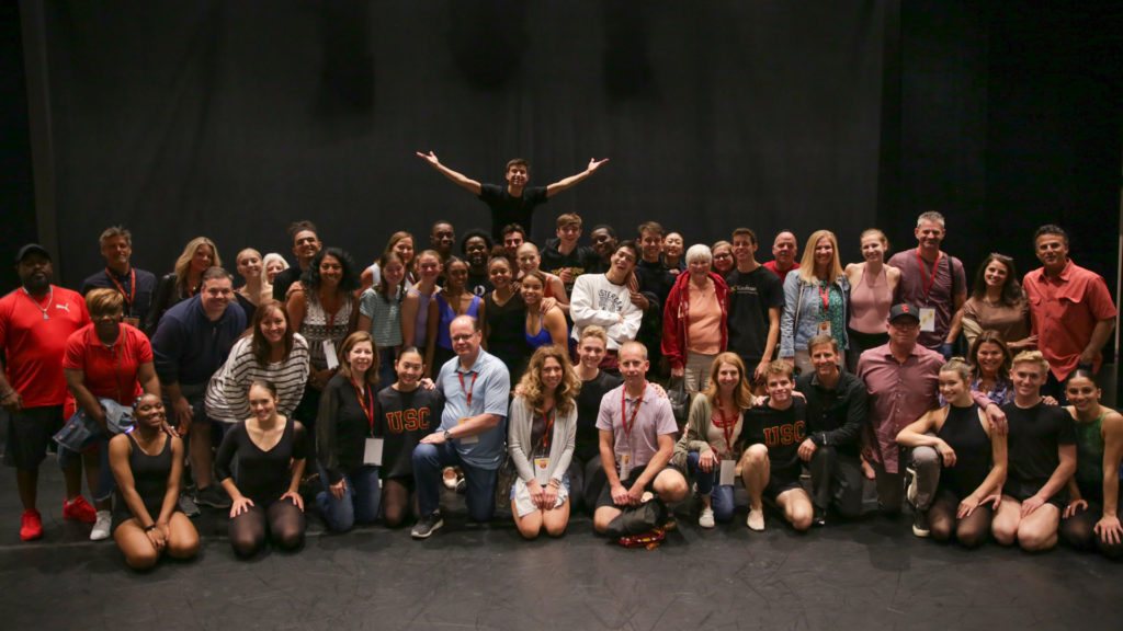 A large group smiles for the camera