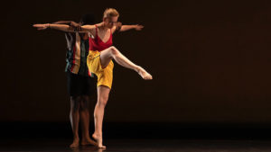 Two dancers partnering on stage