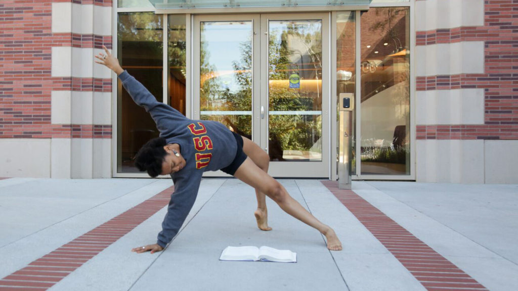 Rachel Harris dancing in front of the Glorya Kaufman International Dance Center