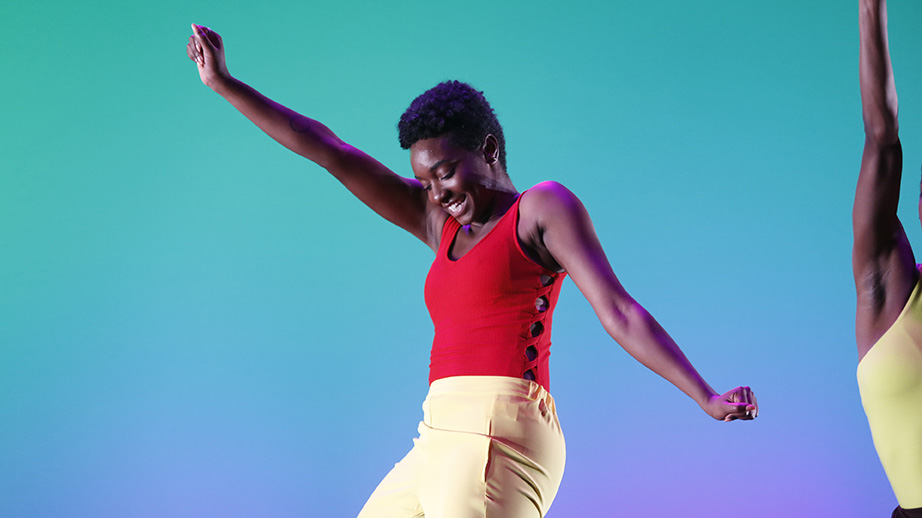 Amaria Stern dancing in red tank and yellow pants