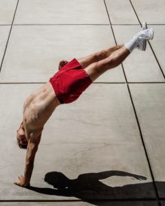 Adam Vesperman balancing on one arm
