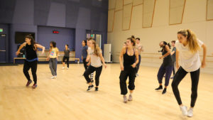 dancers taking hip-hop class in studio