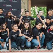 32nd Street Elementary School students pose wearing black Dance On t-shirts