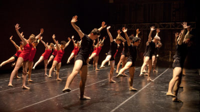 Dancers wearing red and black