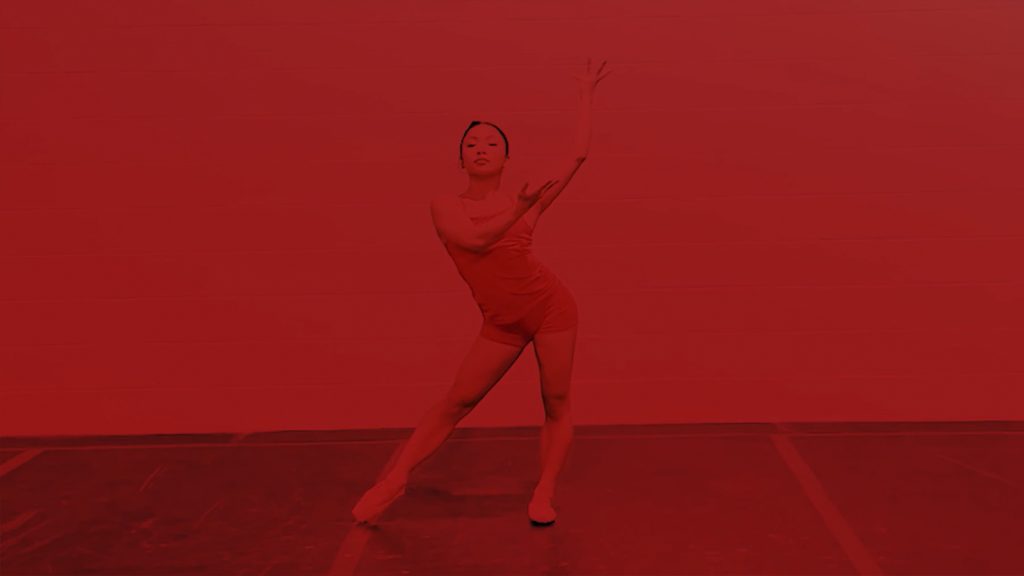 Dancer wearing pointe shoes with a red overlay