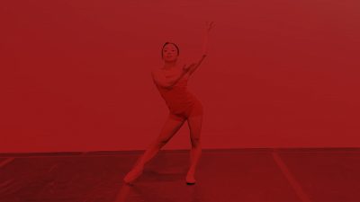 Dancer wearing pointe shoes with a red overlay