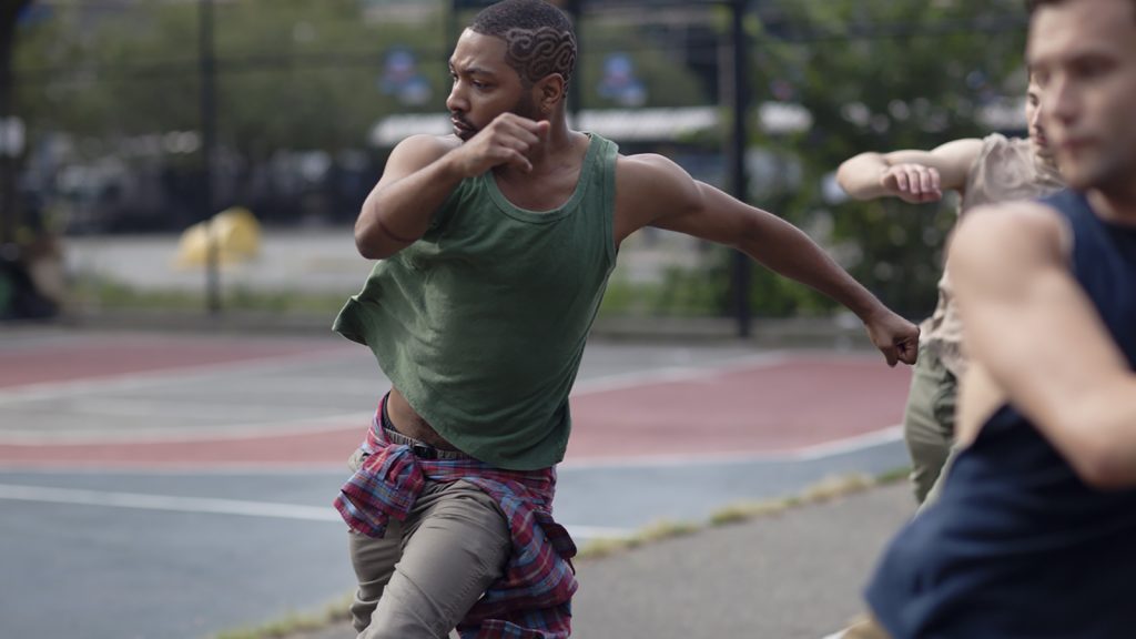 Kyle Abraham dancing on a basketball court