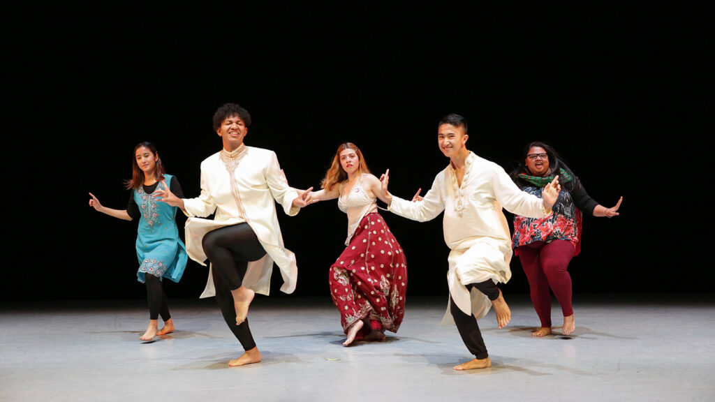 five dancers perform a Bollywood routine