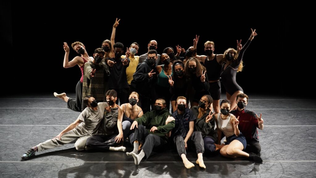 a group of dancers pose for a photo after a show