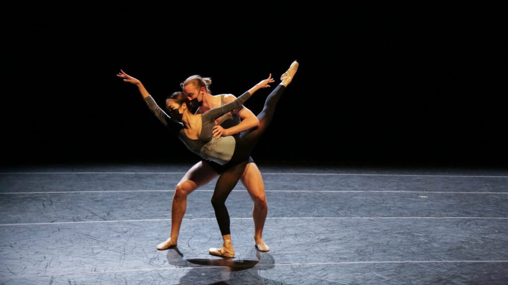 Eileen Kim and Wyeth Walker performing on stage.