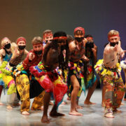 a group of students perform African dance