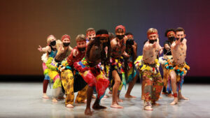 a group of students perform African dance