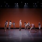 dancers dressed in neutral colors perform Doug Varone choreograhy on stage