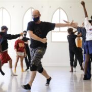 Patrick Corbin dancing in studio with BFA students