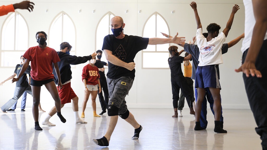 Patrick Corbin dancing in studio with BFA students