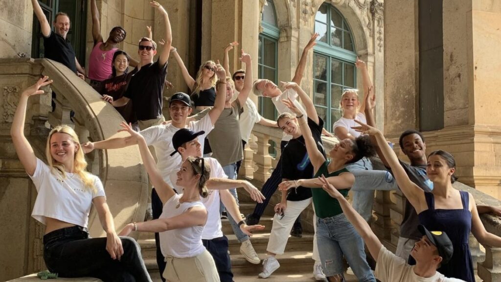 BFA students pose on the steps of a building