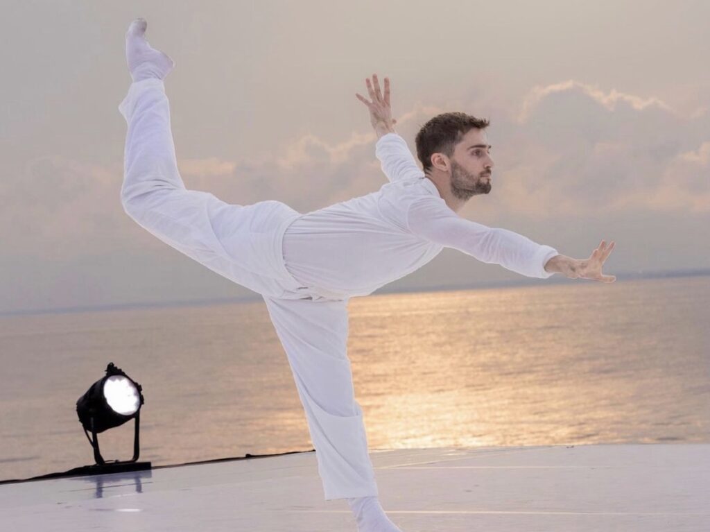 Jake Tribus dancing on an outdoor stage