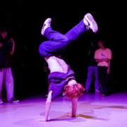 Marcel Cavaliere in a handstand during a cypher