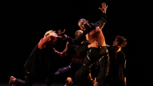 BFA students dancing on stage wearing black