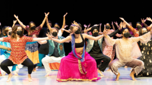 a large group of dancers during a Bollywood piece