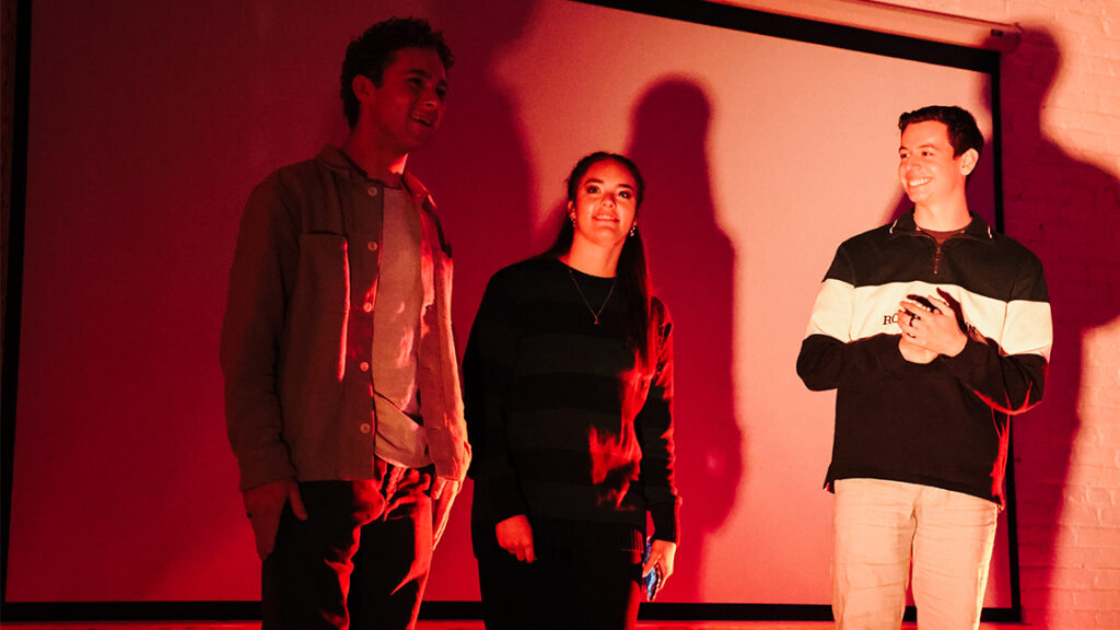 standing left to right: Colin Heino, Emma Sutherland and Brodie Wolf